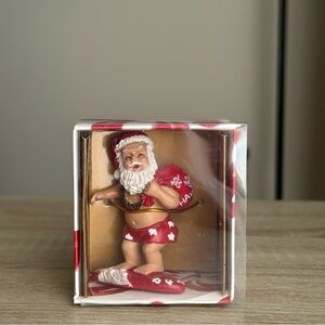 Festive hawaiian Santa Figurine ornament in Red and White
